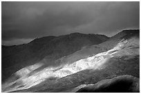Storm light on foothills. Death Valley National Park, California, USA. (black and white)