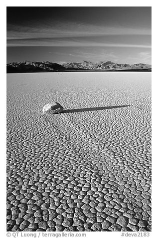 Tracks, sliding stone on the Racetrack playa, late afternoon. Death Valley National Park (black and white)