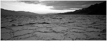 Hexagons on salt pan at sunrise. Death Valley National Park (Panoramic black and white)