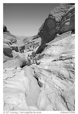 Hikers in narrows, Mosaic canyon. Death Valley National Park, California, USA.