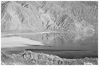 Rare seasonal lake on Death Valley floor and Black range, seen from above, late afternoon. Death Valley National Park, California, USA. (black and white)