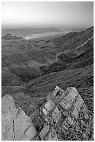 Rocks, canyon and Death Valley from Aguereberry point, sunset. Death Valley National Park, California, USA. (black and white)