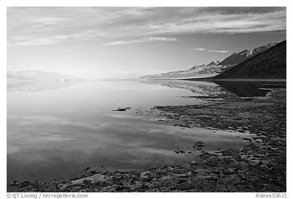 Flooded Badwater basin and Black mountain reflections, early morning. Death Valley National Park, California, USA.