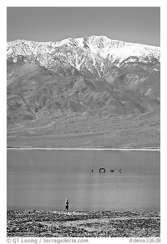 Tourist, ephemeral Loch Ness Monster in Manly Lake, and Telescope Peak. Death Valley National Park (black and white)