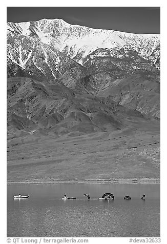 Kayakers near the Loch Ness Monster in Manly Lake, below Telescope Peak. Death Valley National Park (black and white)