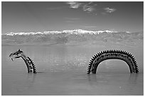 Loch Ness Monster art installation in Manly Lake and Panamint range. Death Valley National Park ( black and white)