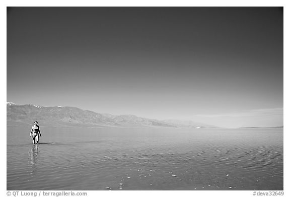 Woman wading in Manly Lake. Death Valley National Park (black and white)