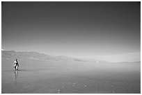 Woman wading in Manly Lake. Death Valley National Park, California, USA. (black and white)