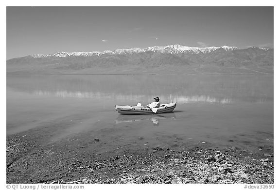 Kayaker near shore in Manly Lake. Death Valley National Park, California, USA.