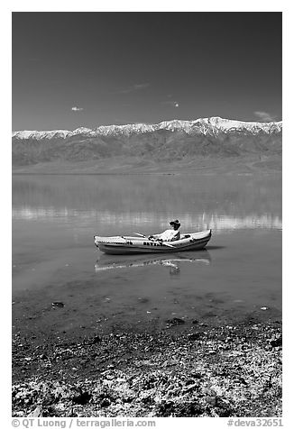 Salt formations, kayaker, and Panamint range. Death Valley National Park (black and white)