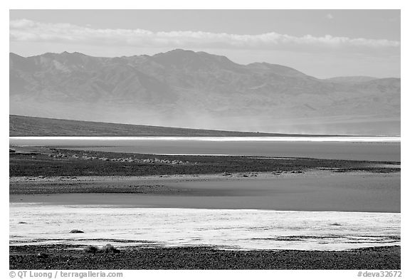 Salt Flats on Valley floor and Owlshead Mountains, early morning. Death Valley National Park (black and white)