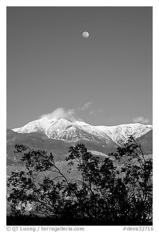 Moon and Panamint Range seen from the West. Death Valley National Park, California, USA.