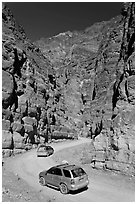 Cars in narrows, Titus Canyon. Death Valley National Park, California, USA. (black and white)