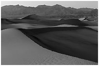 Mesquite Sand dunes and Amargosa Range at dusk. Death Valley National Park ( black and white)