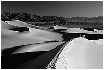 Dune field with hikers, Mesquite Dunes. Death Valley National Park ( black and white)