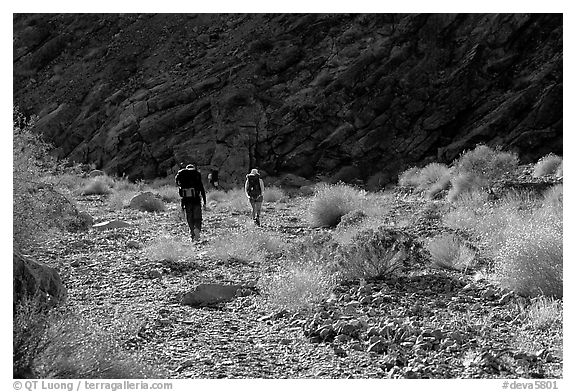 Hikers in a side canyon. Death Valley National Park (black and white)