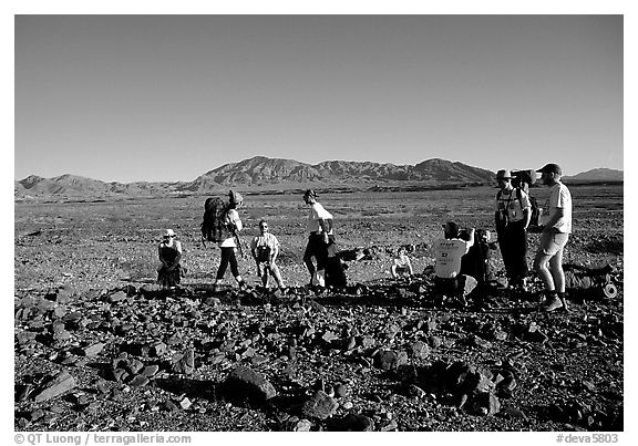 Backpackers on the Valley Floor. Death Valley National Park (black and white)