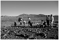 Backpackers on the Valley Floor. Death Valley National Park, California, USA. (black and white)