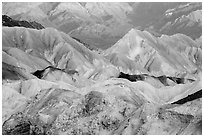 Badlands and mountain lighted by sunrise, Twenty Mule Team Canyon. Death Valley National Park ( black and white)