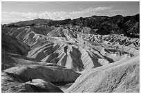 Visitor looking, Zabriskie Point. Death Valley National Park ( black and white)