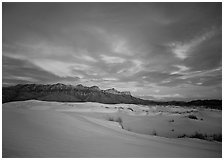 White sand dunes, Guadalupe range, and clouds at sunset. Guadalupe Mountains National Park ( black and white)