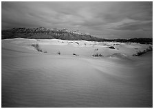 Gypsum dune field and last light on Guadalupe range. Guadalupe Mountains National Park, Texas, USA. (black and white)