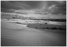 Red light of sunset on white sand dunes and Guadalupe range. Guadalupe Mountains National Park, Texas, USA. (black and white)