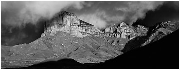 Cliffs and clouds illuminated by low sun. Guadalupe Mountains National Park (Panoramic black and white)
