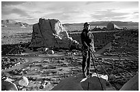 Climber getting ready to rappel down. Joshua Tree National Park, California, USA. (black and white)