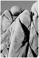 Spherical boulder jammed on top of triangular boulders, Jumbo rocks. Joshua Tree National Park, California, USA. (black and white)