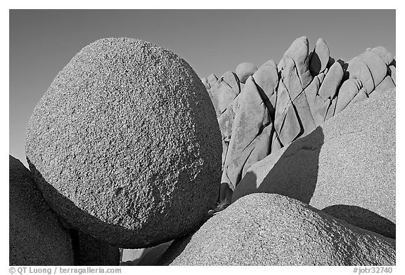 Round and triangular Boulders, Jumbo Rocks campground, sunset. Joshua Tree National Park, California, USA.