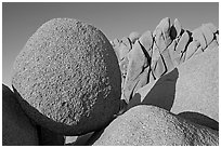 Round and triangular Boulders, Jumbo Rocks campground, sunset. Joshua Tree National Park, California, USA. (black and white)