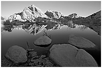 Rockpiles reflected in pond, Barker Dam, sunrise. Joshua Tree National Park, California, USA. (black and white)