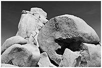 Rocks with climbers in a distance. Joshua Tree National Park, California, USA. (black and white)