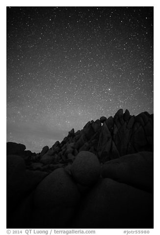 Marble rocks under clear starry sky. Joshua Tree National Park (black and white)