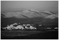 White Tanks rocks and Pinto Mountains at sunset. Joshua Tree National Park ( black and white)