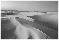 Dunes reflecting lavender colors of the sky at twilight. White Sands National Park ( black and white)