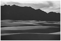 Gypsum dune field and Andres Mountains at sunset. White Sands National Park ( black and white)