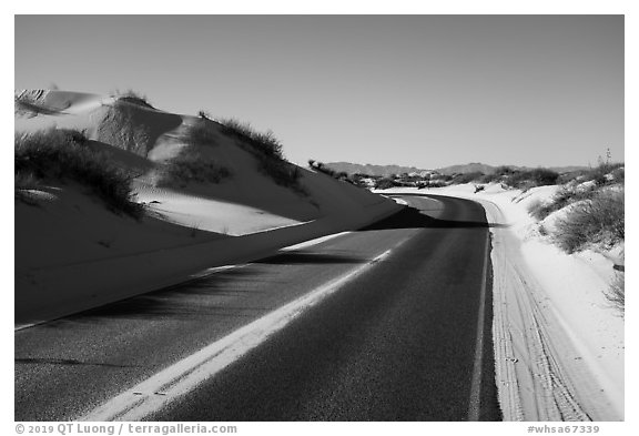 Dunes bordering road. White Sands National Park (black and white)