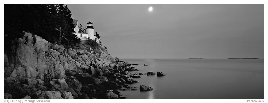 Dusk seascape with lightouse, moon, and reflection. Acadia National Park (black and white)