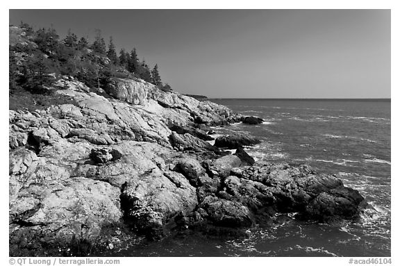 Rocky coast and blue waters, Isle Au Haut. Acadia National Park, Maine, USA.