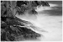 Fog-like water from long exposure at base of cliff. Acadia National Park, Maine, USA. (black and white)