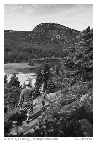 Hikers above Sand Beach. Acadia National Park, Maine, USA.