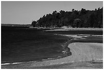 Gravel bar to Bar Harbor Island being submerged by rising tide. Acadia National Park ( black and white)