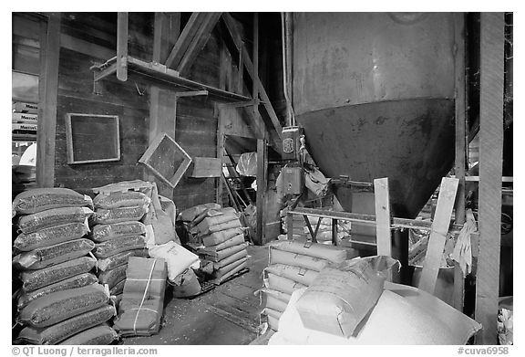 Grain distributor and bags of seeds in Wilson Mill. Cuyahoga Valley National Park (black and white)