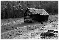 Jim Bales log Cabin in meadow, early morning, Tennessee. Great Smoky Mountains National Park ( black and white)