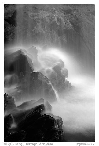 Misty water falling on dark rocks, Grotto falls, Tennessee. Great Smoky Mountains National Park (black and white)
