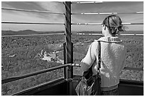 Tourist looking at the view from Hot Springs Mountain Tower in the fall. Hot Springs National Park, Arkansas, USA. (black and white)