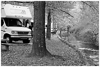 RV, trees in fall colors, and stream. Hot Springs National Park, Arkansas, USA. (black and white)