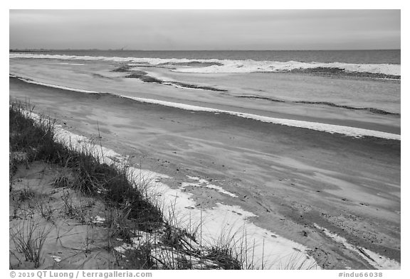 Beach in winter with snow and ice. Indiana Dunes National Park (black and white)